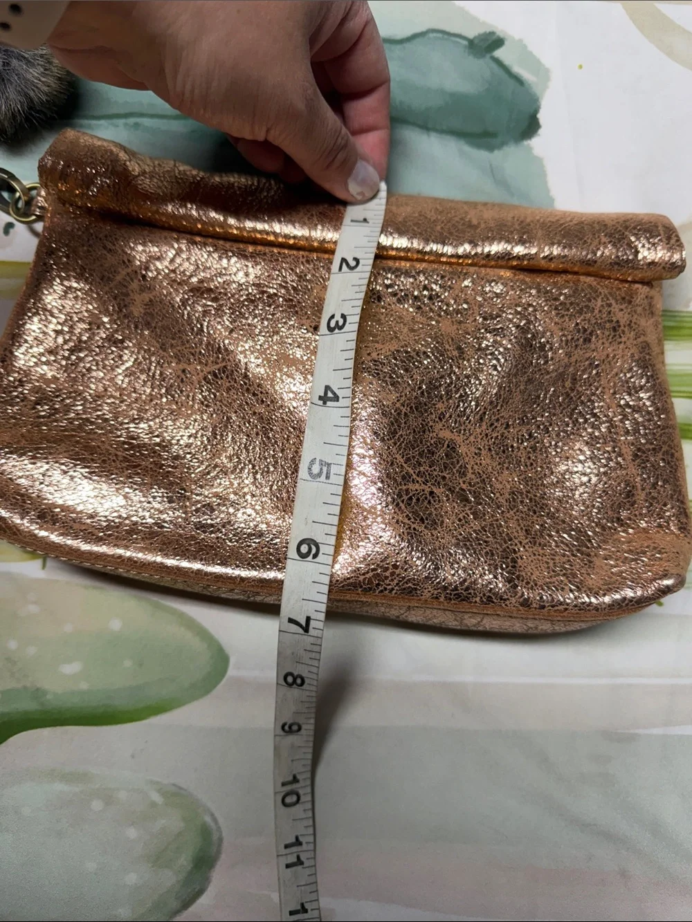 Miss Albright Metallic Rose Gold Wristlet Clutch with Pom Pom Accent